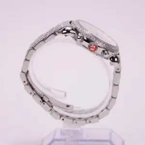 Silver wristwatch on a display stand.