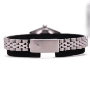 Silver watch bracelet with black background.
