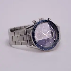 Silver chronograph watch with blue dial.