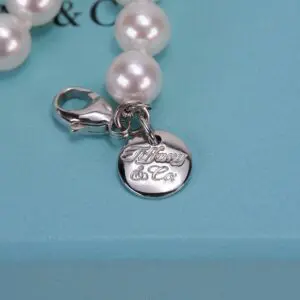 Pearl bracelet with Tiffany & Co. charm.