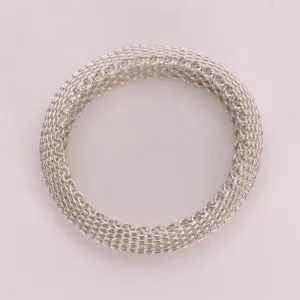 Silver chainmail bracelet on white background.
