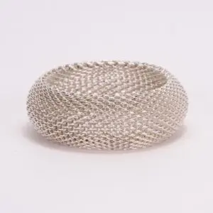 Silver mesh bracelet on white background.
