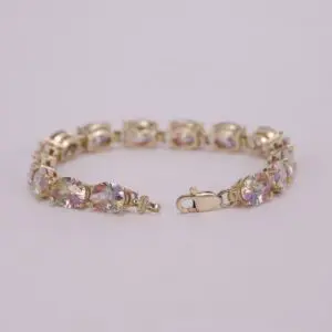 Gold bracelet with colorful gemstone accents.
