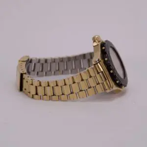 Gold and silver metal wristwatch on display.