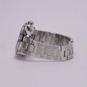 Silver metal watch with linked bracelet.