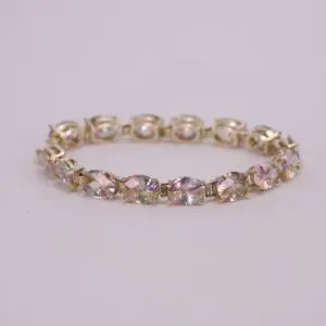 Gold bracelet with colorful gemstone accents.