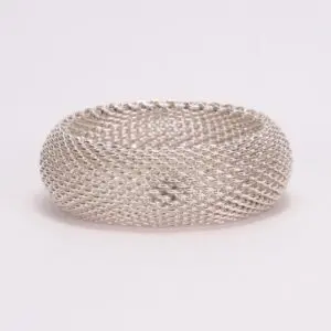 Silver mesh bracelet on white background.