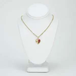 Gold necklace with a heart pendant.