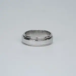 Silver ring on a plain background.