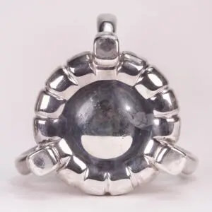 Silver ring with a circular, textured design.