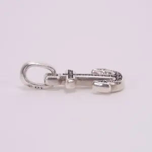 Silver anchor-shaped keychain on white background.