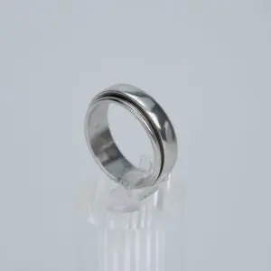 Silver ring on clear display stand.