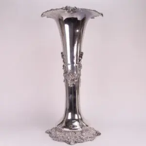 Ornate silver vase with decorative detailing.