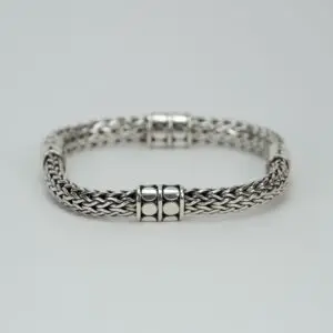 Silver braided bracelet with decorative clasps.