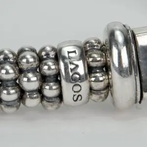 Silver beaded bracelet with "LAGOS" inscription.