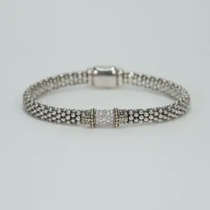 Silver beaded bracelet with decorative clasp.