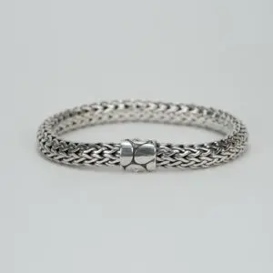 Silver woven bracelet with clasp.