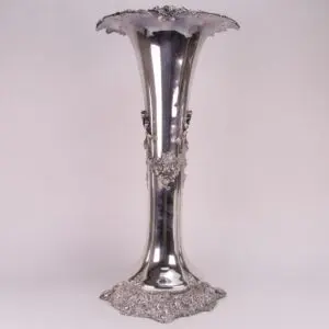 Ornate silver vase with floral patterns.