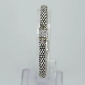 Elegant silver bracelet with decorative clasp.