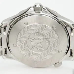 Back of a Seamaster watch with engravings.