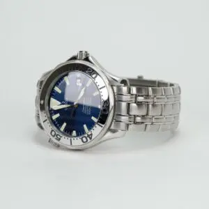 Silver wristwatch with blue dial.