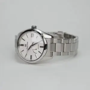 Silver wristwatch with metal bracelet band.
