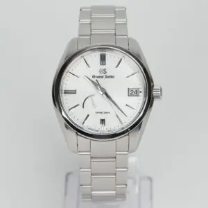 Silver Grand Seiko watch with white dial.