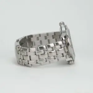 Silver wristwatch with metal bracelet side view.