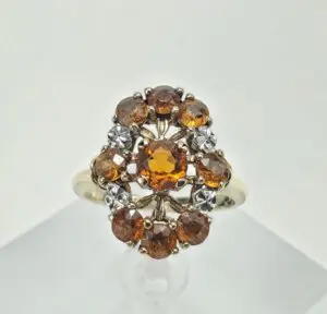Gold ring with amber gemstones and diamonds.