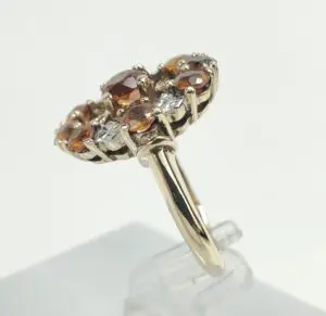 Gold ring with brown and clear gemstones.