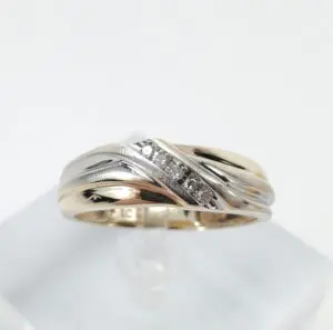Gold and silver ring with diamonds.