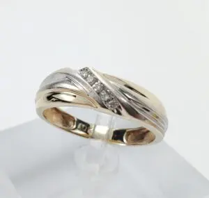 Gold and silver ring with small diamonds.