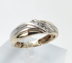 Gold and silver ring with diamonds.