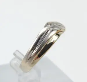 Gold and silver ring with diamonds.