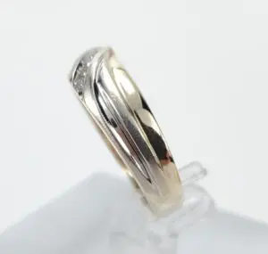 Gold and silver wedding band on display.