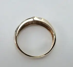 Gold ring on a white background.