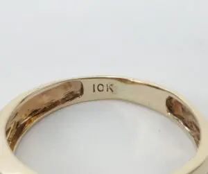 Gold ring with "10K" engraving inside.