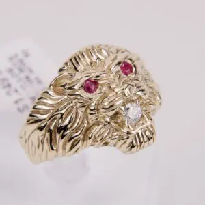 Gold lion ring with ruby eyes.