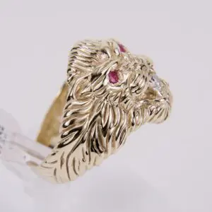 Gold lion ring with ruby eyes.