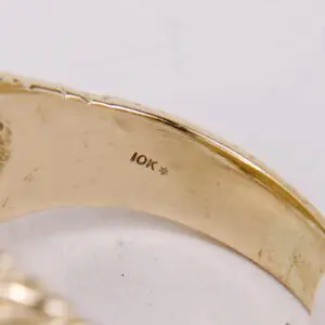 Gold ring stamped with 10K mark.