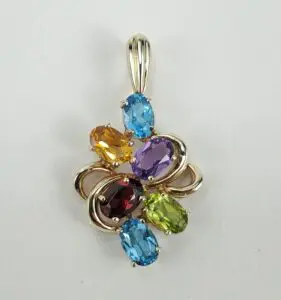 Colorful gemstone pendant with silver accents.