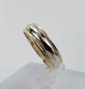 Gold and silver dual band ring.