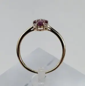 Gold ring with a red gemstone.