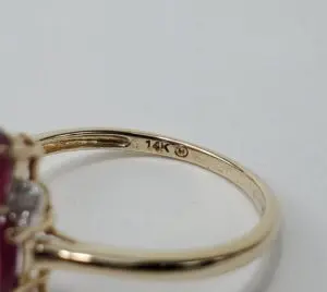 Gold ring with 14K hallmark stamp.