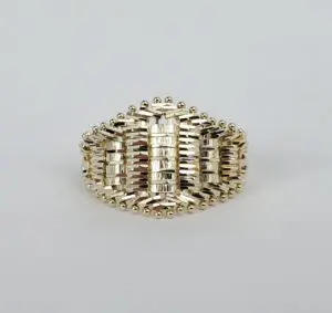 Ornate gold ring with intricate design.