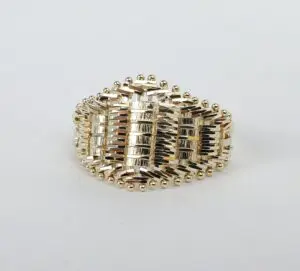 Gold woven-design ring on white background.