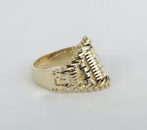 Gold ring with intricate woven design.