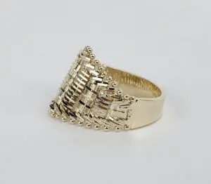 Gold ring with intricate geometric design.