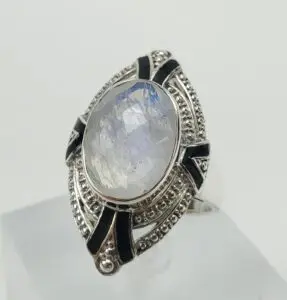 Silver ring with large oval gemstone.