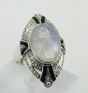 Moonstone ring with intricate silver design.